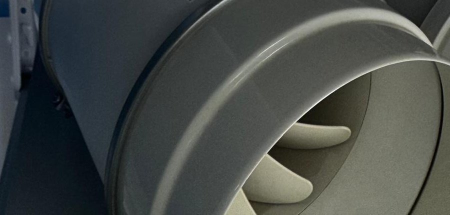 An inline duct fan on the shelf at Top Quality Cooling